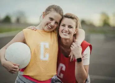 Mother and daughter ready to play netball
